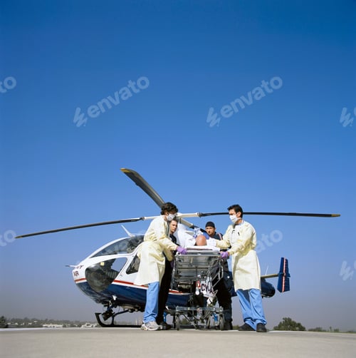 Preview: A Serious Patient Being Rushed By Doctors And Paramedics On Gurney From The Emergency Airlift