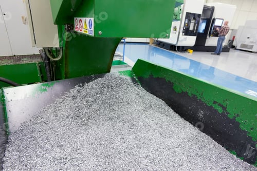 Preview: Horizontal Shot Of A Bin Of Waste Metal From An Engineering Process In A Factory With Copy Space.