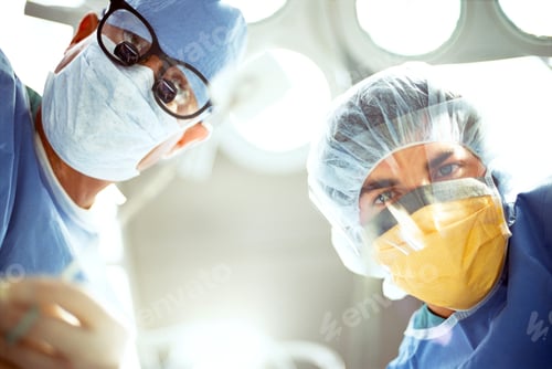 Preview: A Low Angle Pov Of A Patient Seeing Two Surgeons In Surgical Masks Under Surgery Lamp While Looking