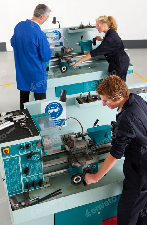 Preview: A High Angle Portrait Shot Of A Young Boy Using A Lathe Machine In A Vocational School With A