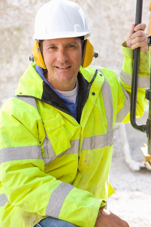 Preview: A Close Up Portrait Shot Of A Construction Worker Wearing Reflective Jacket, Hard Hat And Ear