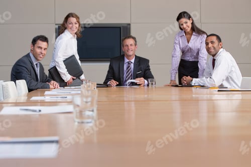 Preview: A Group Portrait Of Smiling Business People Working Together In A Conference Room