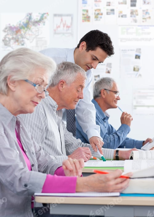 Preview: A Side Profile Portrait Shot Of A Teacher Helping A Senior Man With Gray Hair With The Test In A