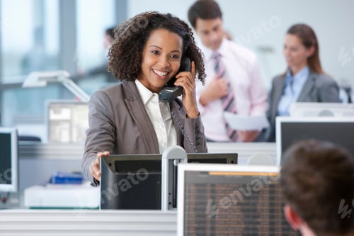 Preview: A Medium Shot Of A Happy Businesswoman With Curly Hair Talking On A Telephone While Standing In Her