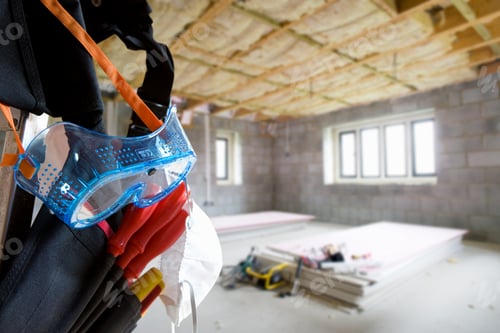 Preview: A Close Up Shot Of Tool Belt And Goggles Hanging From The Ladder With Plywood And Insulation Tools
