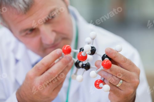 Preview: Horizontal Head And Shoulder Shot Of A Chemical Engineer Examining A Molecular Structure With Focus