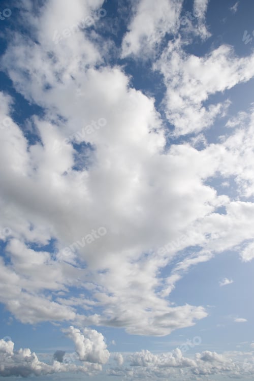 Preview: A Portrait Shot Of Clouds In A Sunny Blue Sky.