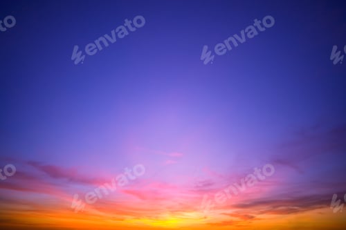 Preview: A Wide Shot Of Beautiful Orange Clouds In A Quiet Blue Sky During Sunset.