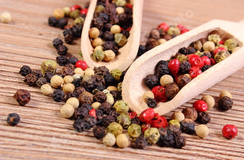 Preview: Heap Of Fresh Colored Pepper With Wooden Spoon Lying On Wooden Table, Seasoning For Cooking