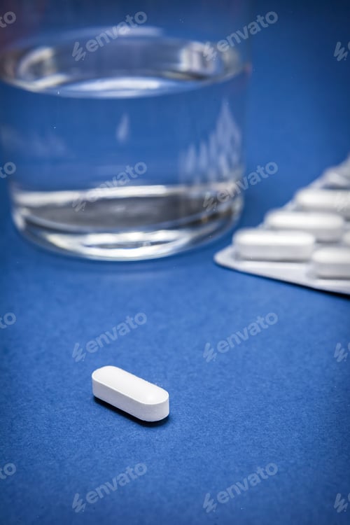 Preview: Water Glass With Pads Isolated On A Blue Background