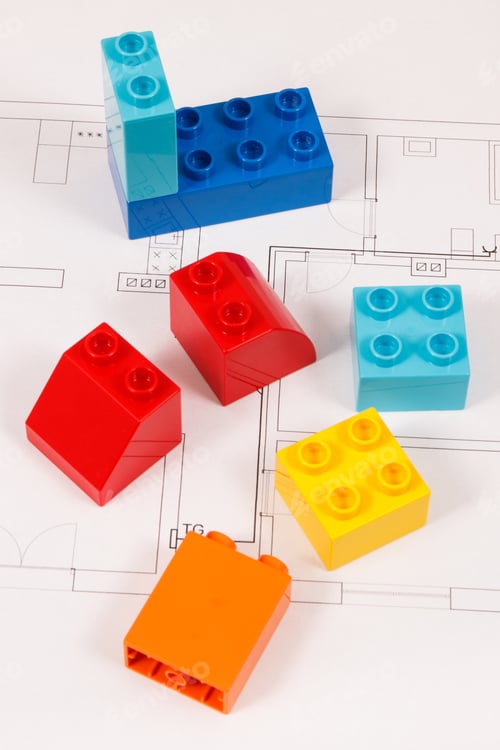 Preview: Colorful Plastic Toy Blocks And Construction Housing Plan. Concept Of Building, Buying Or Renting