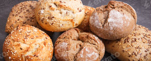Preview: Stack Of Fresh Baked Homemade Wholegrain Rolls With Seeds