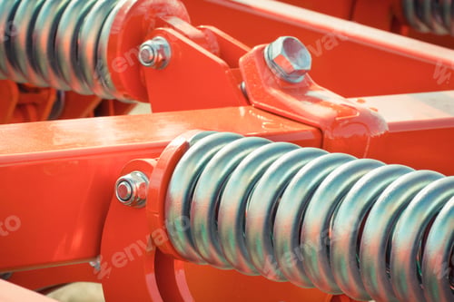 Preview: Big And Hard Steel Silver Spring As Part And Detail Of Red Industrial Or Agricultural Machine
