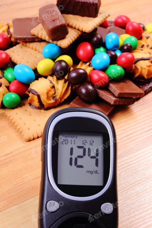 Preview: Glucose Meter With Heap Of Candies And Cookies On Wooden Table, Too Many Sweets, Concept Of