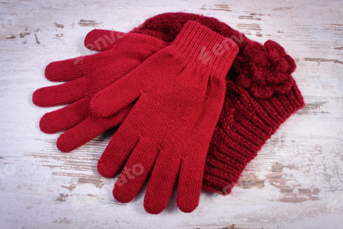 Preview: Pair Of Woolen Gloves And Cap For Woman On Old Rustic Wooden Background, Womanly Accessories, Warm
