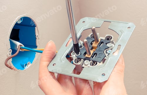 Preview: Hand Of Electrician Using Screwdriver And Installing Power Socket, Technology Concept