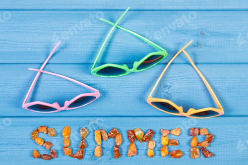 Preview: Inscription Summer Made Of Amber Stones And Colorful Sunglasses On Blue Boards, Summer And Vacation
