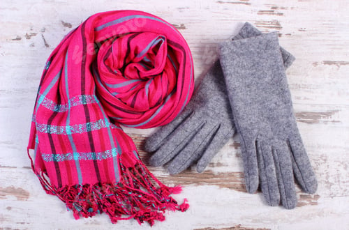 Preview: Pair Of Woolen Gloves And Colorful Shawl For Woman On Old Rustic Wooden Background, Womanly