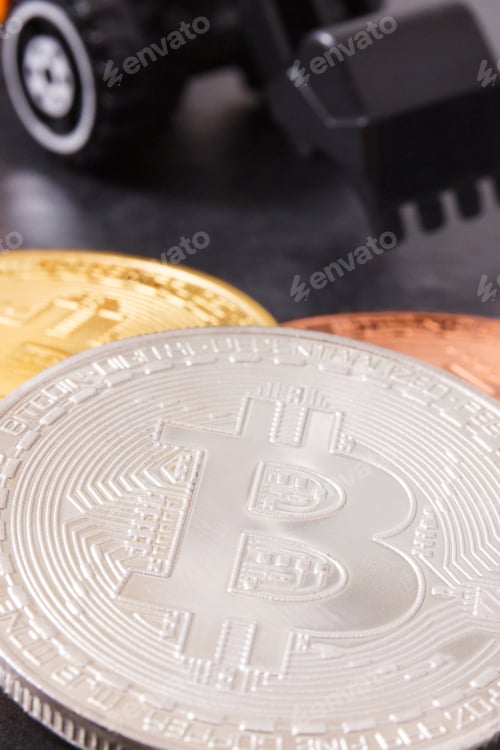 Preview: Silver Bitcoin Coins With Miniature Excavator, Concept Of Mining Cryptocurrency And Modern Finance