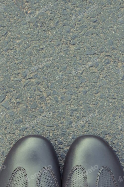 Preview: Comfortable Casual Brown Leather Shoes On Asphalt Road Or Footpath. Male Footwear. Copy Space For