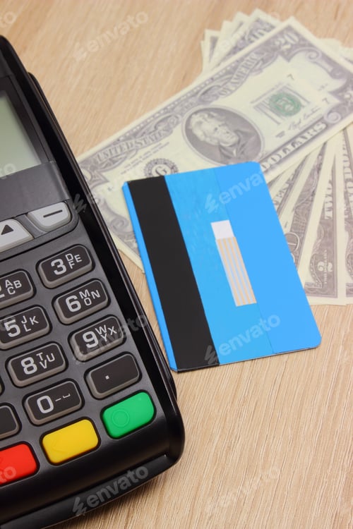 Preview: Payment Terminal With Credit Card And Currencies Dollar On Desk, Paying Using Credit Card Or Cash