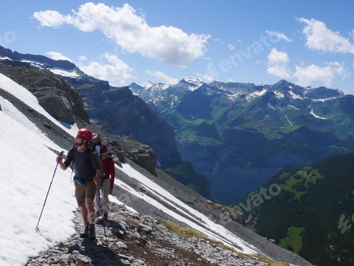 Preview: Mountain Climbers Heading To The Foot Of Eiger And Moench Mountain Peaks In The Swiss Alps Near