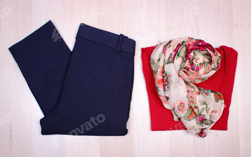 Preview: Womanly Clothes On Wooden Surface Plank, Sweater, Shawl Or Scarf And Pants, Warm Clothing For