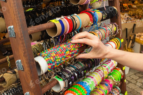 Preview: Hand Of Woman With Colorful Bracelets, Shopping Jewelry And Womanly Accessories On Stall At The