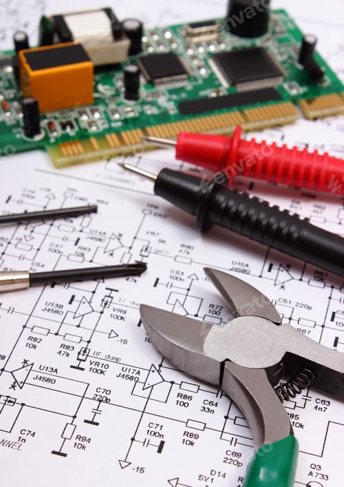 Preview: Printed Circuit Board With Electrical Components, Precision Tools And Cable Of Multimeter On