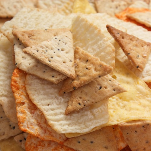 Preview: Heap Of Crunchy Potato Crisps And Cookies On Rustic Board, Concept Of Restriction Eating Unhealthy