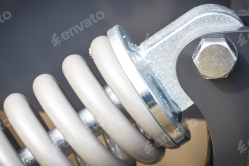 Preview: Hard Gray Spring Made Of Steel. Part Of Big Industrial Or Agricultural Machine. Technology