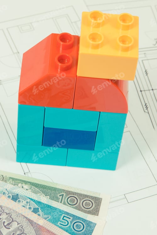 Preview: Colorful Plastic Toy Blocks, Polish Banknote And Construction Drawings Of House. Concept Of Buying