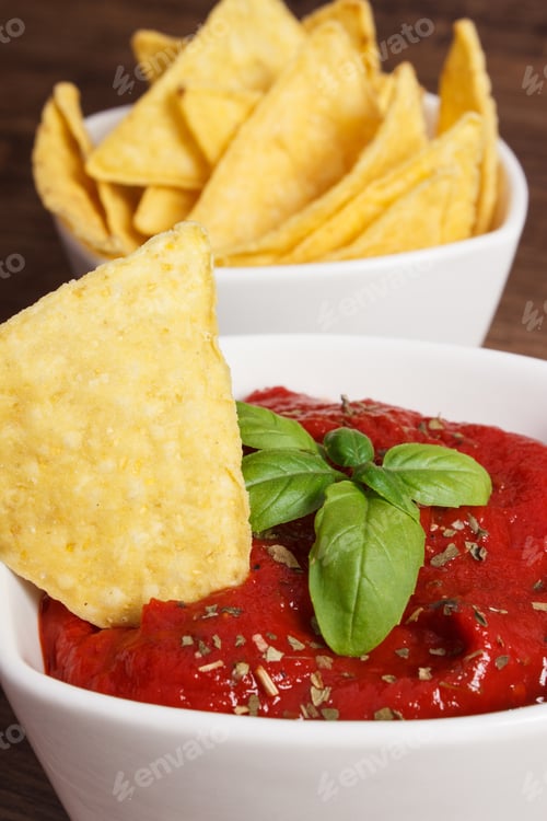 Preview: Crunchy Potato Crisps And Sauce With Basil In Bowls On Rustic Board, Concept Of Restriction Eating