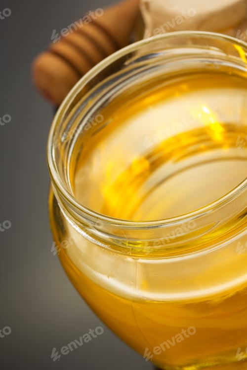 Preview: Glass Jar Full Of Honey On Black Background