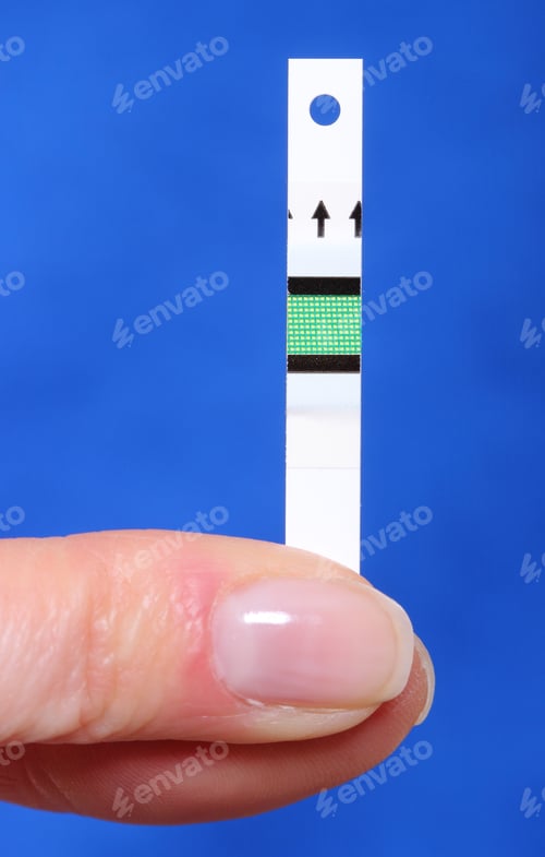 Preview: Closeup Of Strip For Glucose Testing, Measuring Sugar Level. Isolated On Blue Background