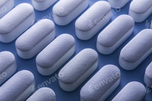 Preview: Some Pills Aligned Isolated On Blue Background