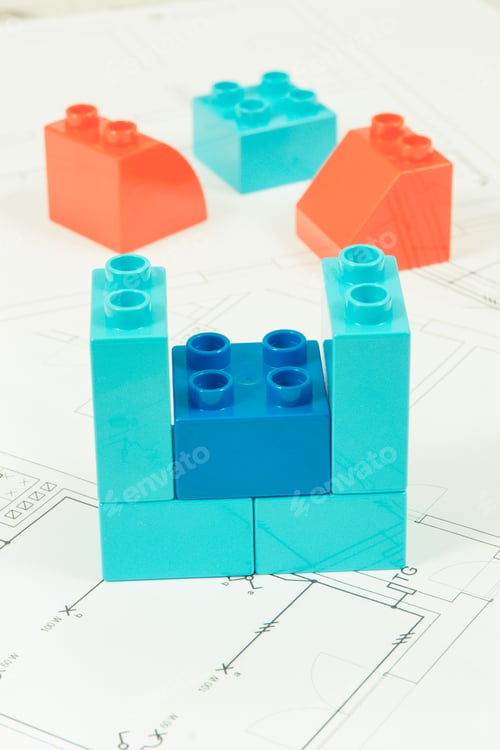 Preview: Colorful Plastic Toy Blocks And Construction Drawings Of House. Concept Of Building, Buying Or