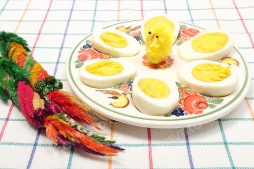 Preview: Easter Palm, Yellow Easter Chicken And Halves Of Eggs Lying On Colorful Plate, Sliced Egg On