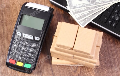 Preview: Credit Card Reader, Payment Terminal With Currencies Dollar, Laptop And Small Wrapped Boxes On