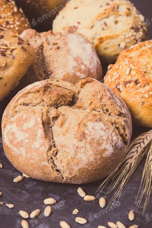 Preview: Fresh Baked Wholegrain Rolls With Seeds And Ears Of Rye Or Wheat Grain. Vintage Photo