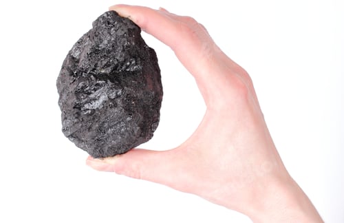 Preview: Woman'S Hand With Coal Lump On White Background