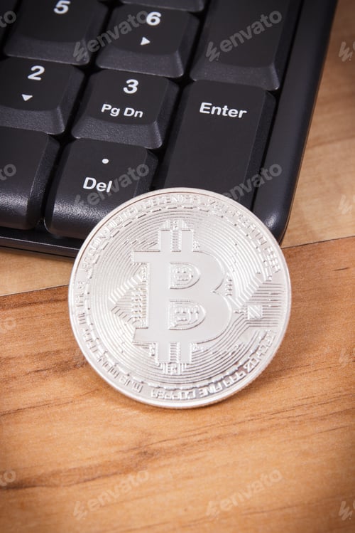 Preview: Silver Bitcoin Coins And Computer Keyboard As Symbol Of Mining Cryptocurrency, Concept Of Modern