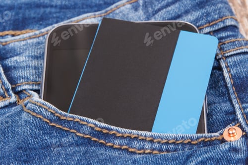 Preview: Credit Card With Mobile Phone In Front Jeans Pocket. Concept Of Cashless Paying For Shopping