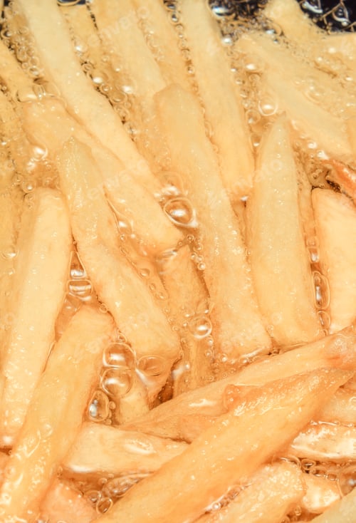 Preview: French Fries Fried In Oil. Unhealthy And Caloric Eating Concept