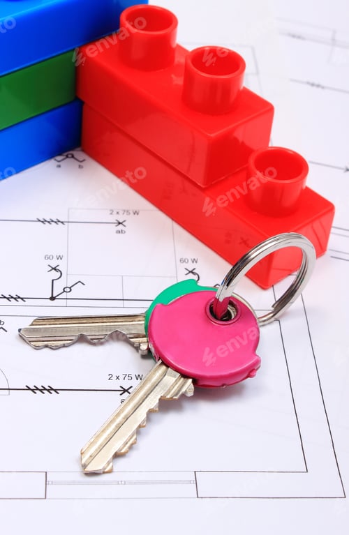 Preview: Home Keys And Wall Of Plastic Colorful Building Blocks Lying On Construction Drawing Of House