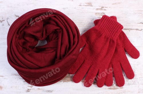 Preview: Pair Of Woolen Gloves And Shawl For Woman On Old Rustic Wooden Background, Womanly Accessories