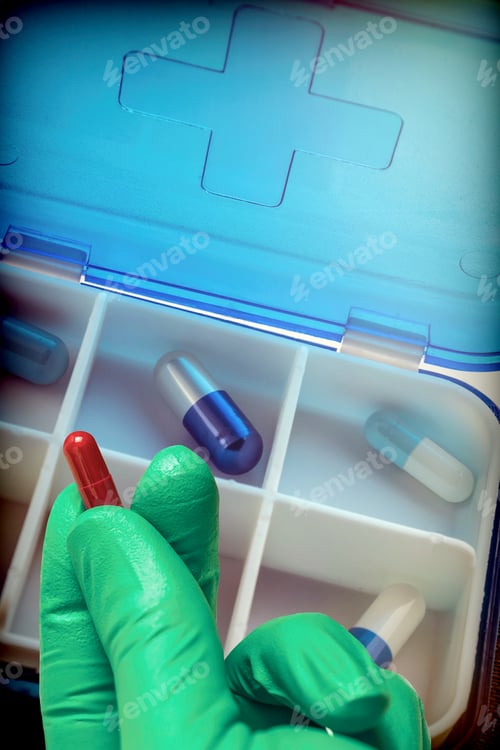 Preview: Hand With Latex Glove Supports Tablet Along With Pillbox, Conceptual Image