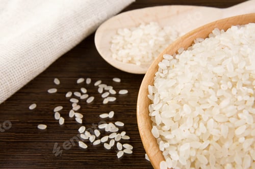 Preview: Rice Grain And Wooden Plate On Table
