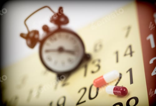 Preview: Pills On A Calendar Next To A Clock, Conceptual Image