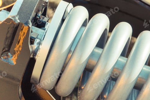 Preview: Steel Spring In Industrial Or Agricultural Machinery. Part Of Hydraulic Or Pneumatic Equipments